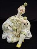 132 - Porcelain nodding dolls.