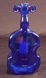 145 - Cobalt fiddle shaped glass bottle.