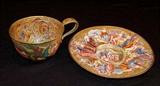 149- Large French enamel cup and saucer, cup has had restoration.