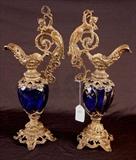 158 - Pair of cobalt blue with gold trim Bohemian glass vases with metal base and worn gilded handles, Art Nouveau, ca. 1890 - 1900.