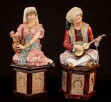 179- Pair of Majolica figures sitting on attached base, Arabian dress with musical instrument, 19in. T.