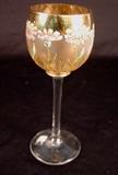 203 - Wine glass with enamel flowers and gold trim.