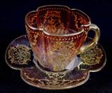 238- Moser glass demitasse cup and saucer, cranberry cut to clear with lots of gold applied.