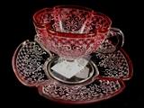 236- Moser type cup and saucer, cranberry with white enamel.