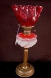 248 - Cranberry opaline glass oil lamp with cranberry shade on brass base, 22in. T.