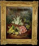 259 - Oil on canvas of pink, yellow and white flowers in basket in gilt frame, signed in right hand corner, 27 x 23.