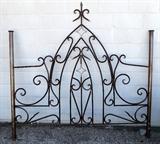 wrought iron panel turned into queen-size headboard