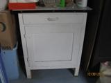 Granite top cabinet.