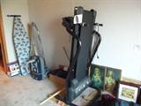 treadmill, religious prints, ironing board, etc