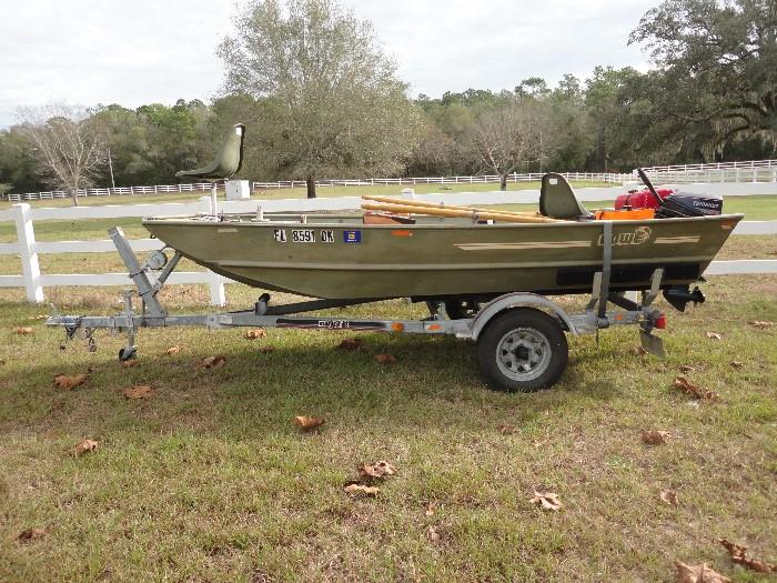 14ft, Lowe Jon Boat, with 15 horse Evinrude Motor and Magic Tilt trailer... Ready for fishing 
