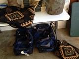several suitcases, including the american indian tapestry set