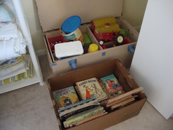 childs books, toy tin barns, tractor, toy box