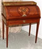 Lot#1031, FRENCH MAHOGANY INLAID WITH FRUITWOOD CYLINDER WRITING DESK, C. 1960-1970, H 39", W 32", D 19"Bronze ormolu; tooled leather writing surface; floral basket fruitwood inlay reserve on cylinder; satinwood string inlay.