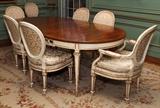 Lot#1041, JOHN WIDDICOMB WALNUT DINING TABLE &  (12) CHAIRS,Louis XVI style set includes 1 oval dining table with a walnut top and decorated white base, H.29" x 67" x 45", with four leaves, each 18" wide, with 2 armchairs and 10 side chairs, decorated white with gold leaf accents.  Thirteen pieces total. Circa 1960. Hand carved.