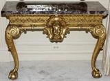 Lot#1042, ITALIAN GILT WOOD CONSOLE WITH MARBLE TOP, H 32", W 43", D 19"A carved mask centers the frieze, raised on cabriole legs ending in claw-and-ball feet.  Measures H.31 1/2" x 43 1/2" x 19".