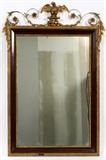 Lot#1045, ENGLISH MAHOGANY MIRROR, 50" X 33"Having carved gilt wood lining the mirror and mahogany frame edge, decorated with applied gilt gesso crest, featuring an eagle form at the center, flanked by scrolled flower and leaf motif.