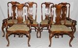 Lot#1046, QUEEN ANNE STYLE FIGURED WALNUT DINING CHAIRS, SET OF EIGHT, 19TH C.Including 2 armchairs and 6 side chairs, each having a scrolled chair rail above a shaped splat and balloon-form seat with petit point seat covers, fan detail at the apron, raised on cabriole legs.