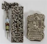 Lot#1094, HOWARD & CO. STERLING CHATELAINE ACCOUTREMENTS & STERLING MATCH SAFE, LATE 19TH C.Including 1 Howard & Co. New York sterling silver case with pierced putti and foliage motif overall, 1888, L.3 1/8", hung with an enameled pencil depicting a horse and jockey in a landscape; and 1 American sterling silver match safe with horse and rider motif, L.2 1/2".  Totaling approximately 1.3 troy oz. weighable.