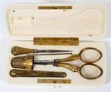 Lot#1207, FRENCH IVORY NECESSAIRE, LATE 19TH C., L 4 3/8"A rectangular ivory hinged case fitted with sewing scissors, thimble, needle case, awl and bodkin.  No apparent markings.