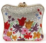 Lot#1225, JUDITH LEIBER MULTICOLOR FLORAL MINAUDIERE, W 5"Full bead multicolor crystal decorated with tulips and other spring flowers, double cabochon push button opens to gold leather lining, coin purse, and comb.  Stamped: Judith Leiber, New York.  Measures W.5" x 4 1/2" (24" to the shoulder strap).