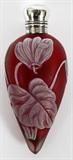 Lot#1231, ENGLISH CAMEO GLASS PERFUME/SCENT BOTTLE, 19TH C., L 3 1/2"Dark pink glass with white overlay floral decoration, sterling silver hinged cap with English hallmarks (rubbed, see additional photo), opening to removable stopper.