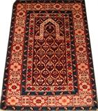 Lot#1305, CAUCASIAN HAND-WOVEN PRAYER RUG, 4' 11" X 3' 4"Having a navy ground with an all over stylized floral motif.