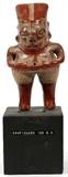 Lot#1320, PRE-COLUMBIAN POTTERY STANDING FIGURE, H 6 3/4'', W 3 3/8''Chupicano collection base 3 1/2'' X 3 1/2'' X 3 1/2''.  On a block base.
