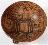 Lot#1321, PRE-COLUMBIAN POTTERY FOOTED BOWL, H 4 1/2'', DIA 8 1/2''Two death masks painted interior, on three rattle feet.