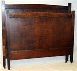 Lot#1397, GUSTAV STICKLEY OAK DOUBLE BED, C. 1900.Trade mark at lower center of headboard. With side rails.