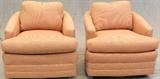 Lot#1540, TUB STYLE UPHOLSTERED SWIVEL CHAIRS, PAIR,Two tub chairs upholstered in micro checked red/yellow on upholstered round swivel base, each with an accent.  Measures H.31" x 31" x 35".