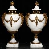 Lot#2052, FRENCH MARBLE AND DORE BRONZE COVERED URNS, 19TH.C., PAIR, H 20", W 10 1/2"Loose covers.  Bronze mounts.  Ram's heads side handles; dore swags. Fruit cluster finials.  White with gray veining. PAIR, H 20", W 10 1/2"