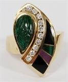 Lot#2065, 14KT YELLOW GOLD 1.50CT CARVED EMERALD & DIAMOND RING, 11.4GR,Featuring a pear shape 1.50 carat carved natural emerald at one side, with enameled geometric design at the other; 0.50 carats of round diamonds line the middle. The total weight of the ring is approximately 11.4 grams. Size 6.5.