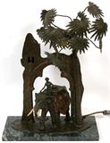 Lot#2155, ANDREAS RUFF, AUSTRIAN COLD PAINTED BRONZE FIGURAL LAMP, H 19"Andreas Ruff [Austrian B. 1885]  Depicting a man riding an elephant under an arch with palm tree.  Mounted on a marble base H .75", L 14", D 6.75.  Signed Ruff Austria.  Antique. -