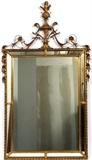 Lot#2169, 20TH C. WALL MIRROR WITH MIRRORED GLASS FRAME, H 57", W 33"Prince of Wales style finial; foliate/floral motifs joined by gilt vines.