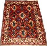 Lot#2201, PERSIAN TABRIZ STYLE, HAND-WOVEN RUG, 4' 8" X 3' 7",Having a red field with an ivory border. Decorated in an all over floral motif, with six cypress tree diamond medallions at the center.