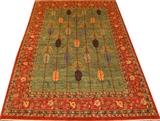 Lot#2204, MAHI RUG, W 74" L 105"Colors of rust, green, mustard, taupe, and black. Designs of leaves on main center of rug.