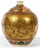 Lot#2293, JAPANESE SATSUMA VASE, H 4" W 3"Incised mark at underside; signed at side. Having all over enameled decoration, featuring two panels at either side; one depicting a landscape scene with 3 figures on a gilt ground, the other with red flowers on a black ground. Measures H. 4" x 3".