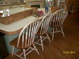 4 white and wood chairs