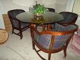glass & wood round table w/4 chairs on rollers