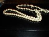 36 3/4" long, 100 round real pearls w/14K clasp, have recent appraisal on this item