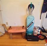Festive camel ottoman +  Oreck XL2 upright vacuum + small black Oreck vacuum