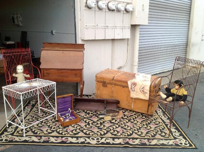 Old desk, antique chest, Vintage rug, Wooden Last Rites Box , Old shelf, monkey and Casper in wire chairs