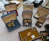 Several cufflinks and tie clips