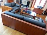Stickley leather and cherry sofa and loveseat along with Stickley coffee table, cedar chest, cabinet, and sofa table