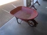 Sturdy metal wheelbarrow with pneumatic tire.