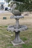 cement bird bath with pelican