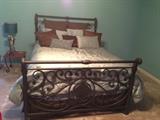 Wrought Iron Style queen Size Bed, Brass Table Lamp, and End Table