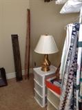 Wall Shelves, Bamboo Rods, Plastic Organizers, Brass Lamps, and Quilts
