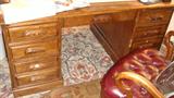 Front of executive desk with partial view of executive office chair