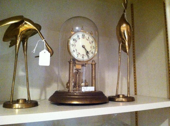                         domed clock; brass cranes